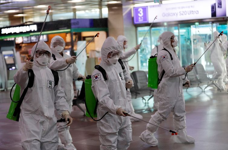 South Korean soldiers spray disinfectant at the international airport amid the rise in confirmed cases of coronavirus disease (COVID-19) in Daegu