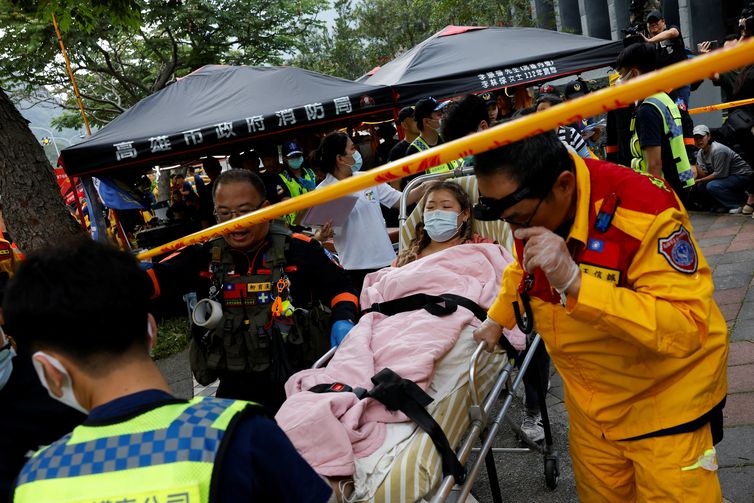 A wounded woman is taken for a medical check-up after being rescued from a remote area, following the earthquake, in Hualien, Taiwan, April 4, 2024. REUTERS/Tyrone Siu
