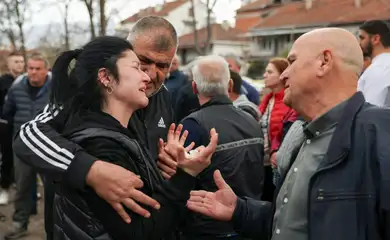 People react outside a hospital, following a fire in a night club resulting in casualties, in the town of Kocani, North Macedonia, March 16, 2025. REUTERS/Alexandros Avramidis