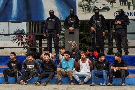 Police officers present the detainees who stormed the TC Television studio during a live TV broadcast amid the ongoing wave of violence around the nation, in Guayaquil, Ecuador January 10, 2024. REUTERS/Vicente Gaibor del Pino     TPX IMAGES OF THE DAY