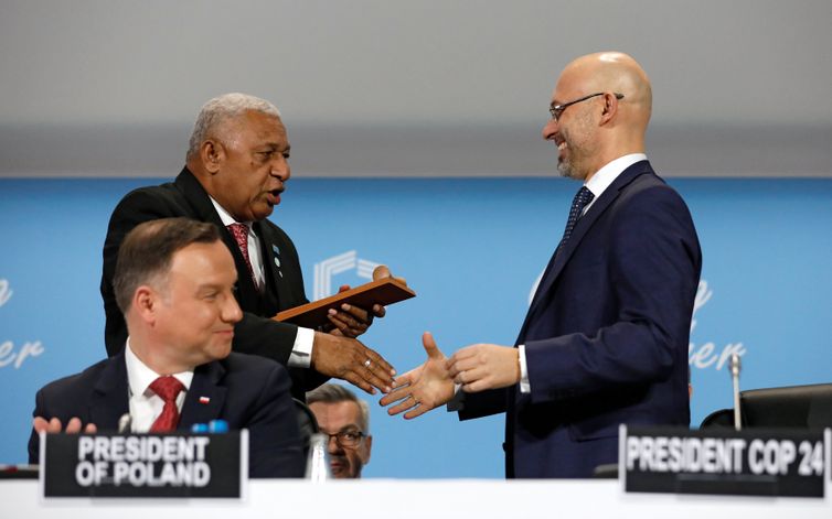 Prime Minister of Fiji and COP 23 President Frank Bainimarama talks with the President of COP 24 Michal Kurtyka as Polish President Andrzej Duda looks on during the opening of COP24 UN Climate Change Conference 2018 in Katowice, Poland December