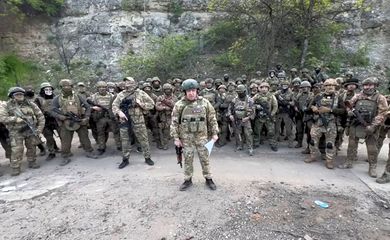 Founder of Wagner private mercenary group Yevgeny Prigozhin makes a statement as he stand next to Wagner fighters in an undisclosed location in the course of Russia-Ukraine conflict, in this still image taken from video released May 5, 2023.