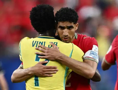Soccer Football - FIFA World Cup 2026 - Group C - Brazil v Morocco - New York/New Jersey Stadium, East Rutherford, New Jersey, U.S. - June 13, 2026 Morocco's Achraf Hakimi embraces Brazil's Vinicius Junior after the match REUTERS/Dylan Martinez