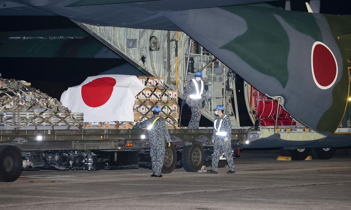 Japan Self-Defense Forces officers load relief supplies to be deployed to Tonga, in Komaki