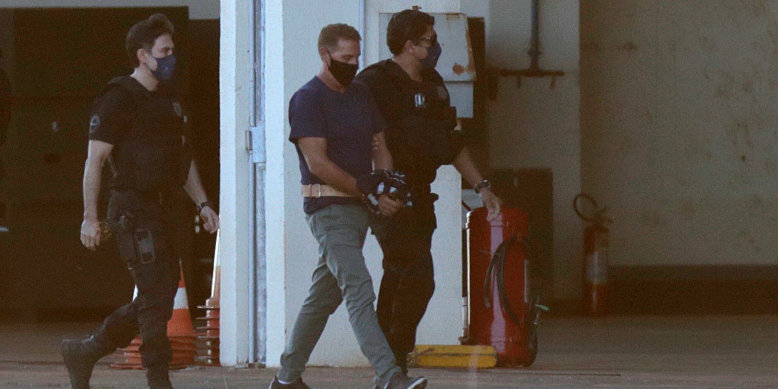 Italian drug lord Rocco Morabito is escorted by federal police, in Brasilia
