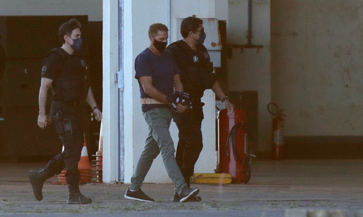 Italian drug lord Rocco Morabito is escorted by federal police, in Brasilia