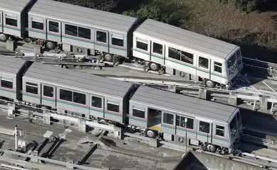 A Nippori-Toneri Liner train is derailed slightly after an earthquake jolted the Tokyo region the previous night in Tokyo