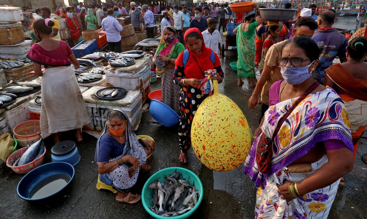 People are seen at a fish market, amidst the spread of the coronavirus disease (COVID-19), in Mumbai