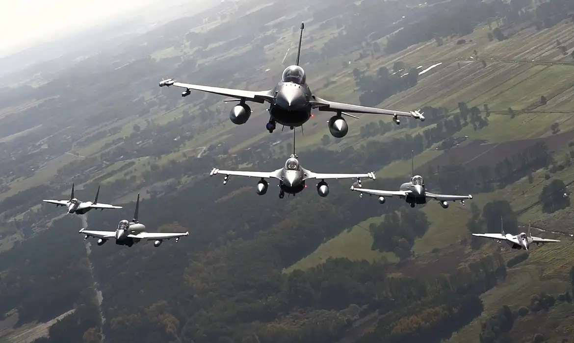 **VIDEO AVAILABLE: CONTACT INFO@COVERMG.COM TO RECEIVE**

Fighter jets from Italy, Poland and the United States took to the skies over NATO’s eastern flank as part of NATO’s Air Shielding mission. The line-up of aircraft included Italian Eurofighters, Polish F-16s and Polish MiG-29s and United States F-22s. The planned one-day series of aerial manoeuvres were conducted from Łask Air Base in Poland on 12 October 2022.

NATO’s Air Shielding mission is an increased air and missile defence posture along the Alliance’s eastern flank, implemented in the wake of Russia’s brutal invasion of Ukraine. Allies have deployed more fighter jets and ground-based air and missile defence systems to protect Allies along the eastern flank against possible air and missile threats. This is purely defensive, and a key component of NATO's enhanced deterrence and defence posture. NATO’s Air Shielding involves deployments ranging from a few weeks to several months at air bases and key locations in the eastern part of the Alliance.

Footage includes aerial manoeuvres of Italian Eurofighters, Polish F-16s and MiG-29s, and US F-22s.

The aerial manoeuvres come amid increased tensions on NATO's Eastern flank due to Russia's war in Ukraine and threats from Kremlin leaders to members of the NATO Alliance.

Where: Łask Air Base, Poland
When: 12 Oct 2022
Credit: US Air Force/Cover Images

**EDITORIAL USE ONLY. MATERIALS ONLY TO BE USED IN CONJUNCTION WITH EDITORIAL STORY. THE USE OF THESE MATERIALS FOR ADVERTISING, MARKETING OR ANY OTHER COMMERCIAL PURPOSE IS STRICTLY PROHIBITED. MATERIAL COPYRIGHT REMAINS WITH STATED SUPPLIER.**