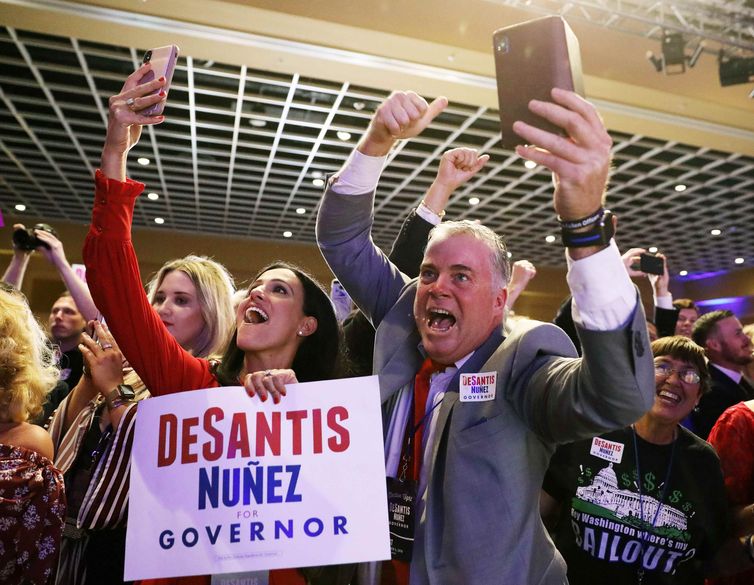 Supporters for Republican gubernatorial candidate Ron DeSantis celebrate during his midterm election night party in Orlando, Florida, U.S. November 6, 2018. REUTERS/Carlo Allegri