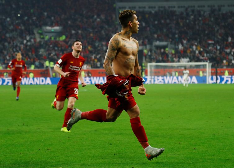 Soccer Football - Club World Cup - Final - Liverpool v Flamengo - Khalifa International Stadium, Doha, Qatar - December 21, 2019  Liverpool's Roberto Firmino celebrates scoring their first goal  REUTERS/Ibraheem Al Omari