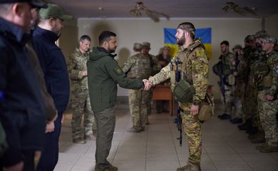 Ukraine's President Zelenskiy awards a Ukrainian service member near a frontline in Kharkiv region