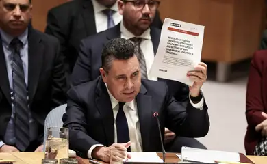 Venezuela Ambassador to the United Nations Samuel Reinaldo Moncada Acosta speaks as he holds up a news article, during a UN Security Council meeting on U.S. strikes and the capture of Venezuelan President Nicolas Maduro and his wife, Cilia Flores, at the United Nations headquarters in New York, U.S., January 5, 2026. REUTERS/Brendan McDermid