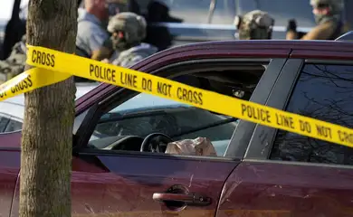 Police tape surrounds a vehicle after its driver was shot by a U.S. immigration agent, according to local and federal officials, in Minneapolis, Minnesota, U.S., January 7, 2026. REUTERS/Tim Evans     TPX IMAGES OF THE DAY