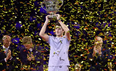 Tennis - ATP 500 - Swiss Indoors Basel - St. Jakobshalle, Basel, Switzerland - October 26, 2025 Brazil's Joao Fonseca celebrates with the trophy after winning his final against Spain's Alejandro Davidovich Fokina REUTERS/Pierre Albouy
