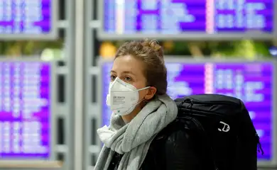 Flight passenger wears a protective mask at Frankfurt Airport