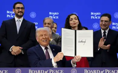 U.S. President Donald Trump takes part in a charter announcement for his Board of Peace initiative aimed at resolving global conflicts, alongside the 56th annual World Economic Forum (WEF), in Davos, Switzerland, January 22, 2026. REUTERS/Jonathan Ernst