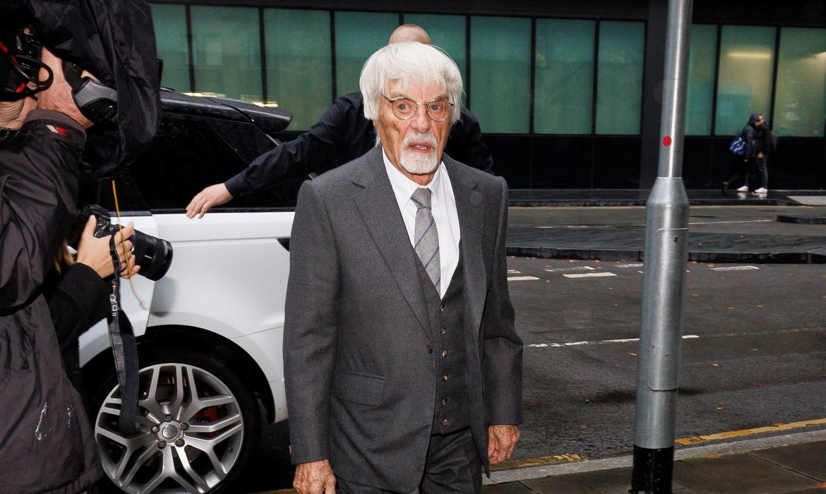 Bernie Ecclestone arrives for a fraud case hearing, in London