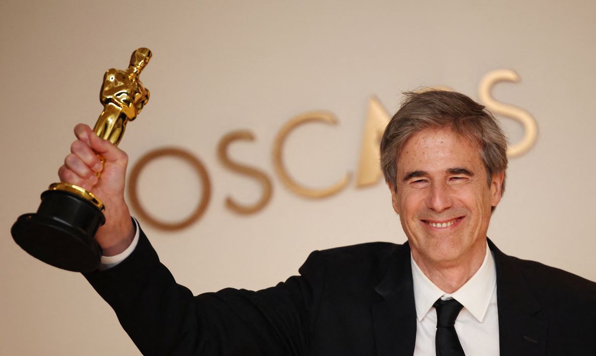 Director Walter Salles poses with the Oscar for Best International Feature Film for