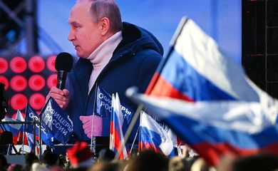 Russian President Vladimir Putin attends a concert marking the eighth anniversary of Russia's annexation of Crimea in Moscow