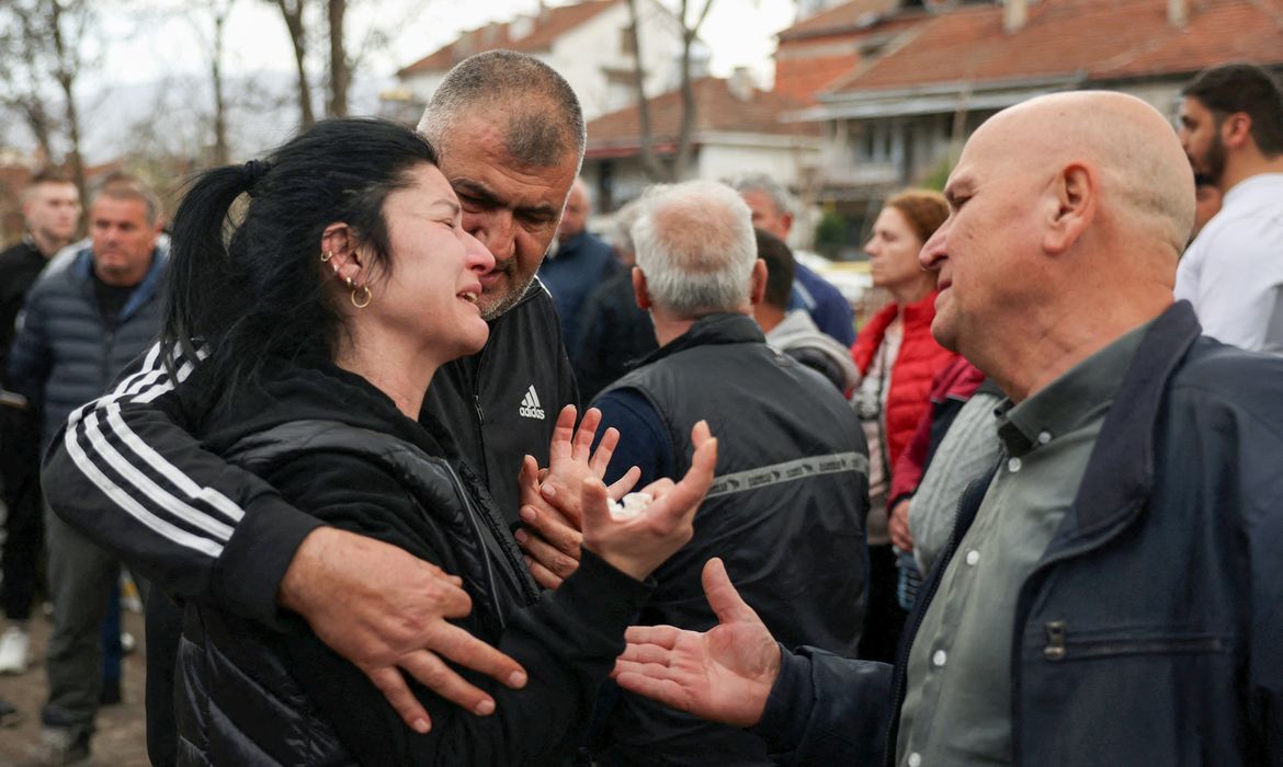 People react outside a hospital, following a fire in a night club resulting in casualties, in the town of Kocani, North Macedonia, March 16, 2025. REUTERS/Alexandros Avramidis