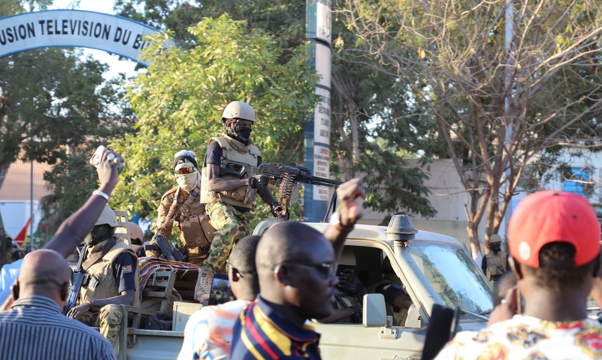 People show their support for the military after they deposed President Kabore outside state Television RTB headquarter, in Ouagadougou