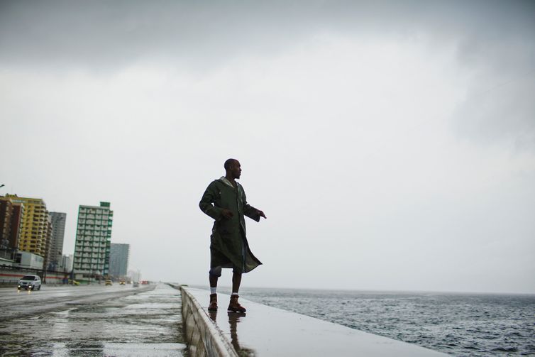 Alexander Charnicharo fishes at the seafront in Havana as Hurricane Michael passes by western Cuba on October 8, 2018. REUTERS/Alexandre Meneghini