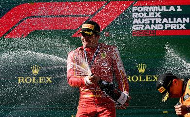 Formula One F1 - Australian Grand Prix - Melbourne Grand Prix Circuit, Melbourne, Australia - March 24, 2024
Ferrari's Carlos Sainz Jr. sprays sparkling wine and celebrates on the podium after winning the Australian Grand Prix REUTERS/Jaimi Joy