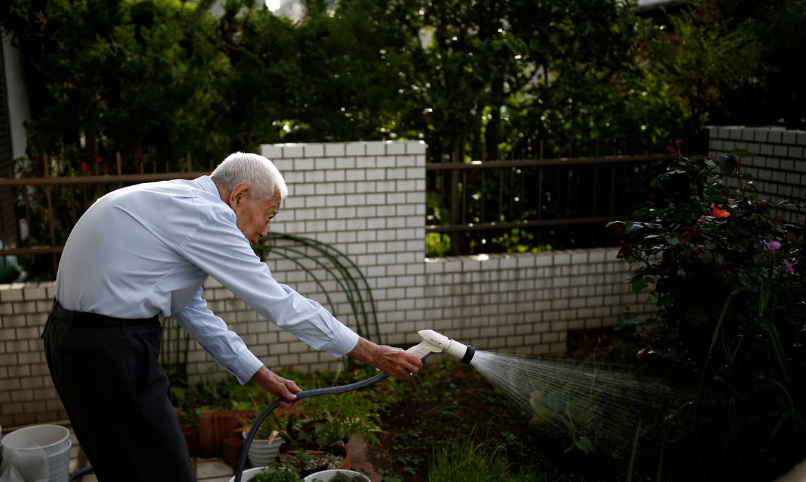 Ryuichi Nagayama, 86, Fuwaku Rugby Club's oldest active player, waters his garden at his house in Tokyo, Japan, May 18, 2019. As a doctor, Nagayama is well aware of the risks involved in playing a high impact sport at his age and the club's