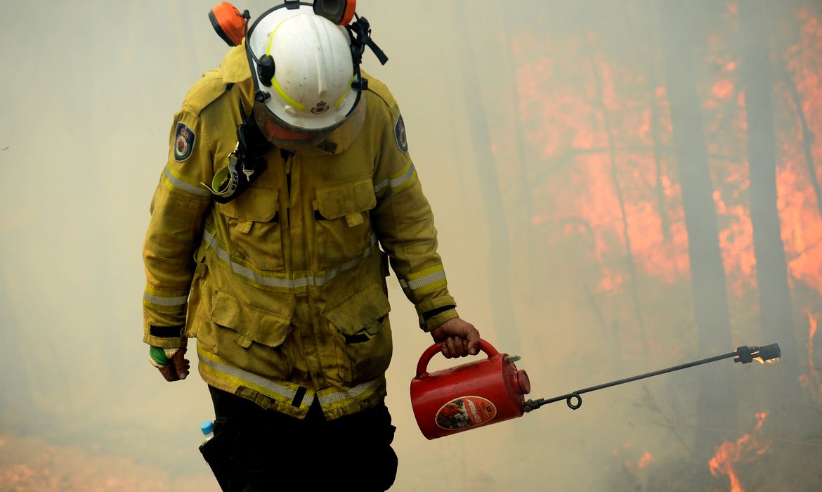 A NSW Rural Firefighter establishes a backburn during bushfires in Mangrove Mountain, New South Wales, Australia,  December 8, 2019. AAP Image/Jeremy Piper/via REUTERS ATTENTION EDITORS - THIS IMAGE WAS PROVIDED BY A THIRD PARTY. NO RESALES. NO