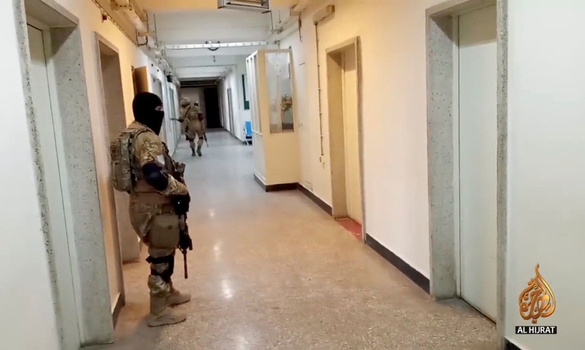 Taliban soldiers are seen in hospital hallway amid reports of hospital explosions in Kabul