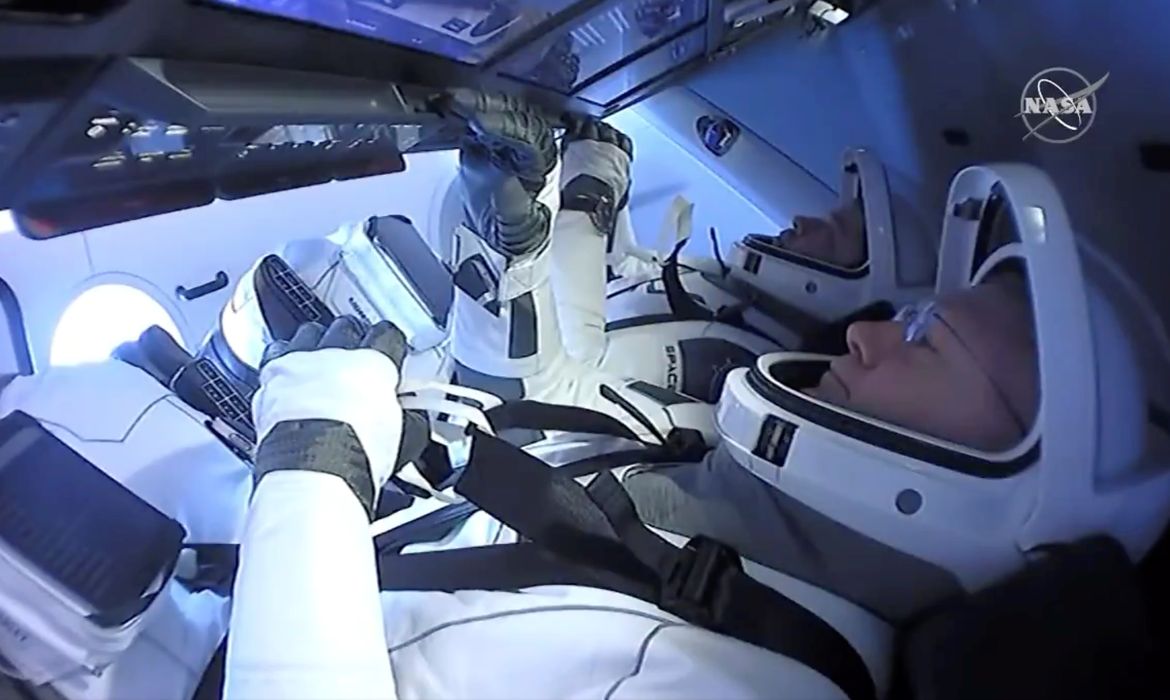NASA astronauts Robert Behnken and Douglas Hurley are seen aboard SpaceX's Dragon Endeavour spacecraft