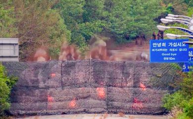 Fire and smoke rises after North Korea blows up sections of inter-Korean roads on its side of the border between the two Koreas, according to South Korea's military, as seen from the South Korean side, October 15, 2024, in this screen grab from a handout video. South Korean Defence Ministry/Handout via REUTERS    THIS IMAGE HAS BEEN SUPPLIED BY A THIRD PARTY