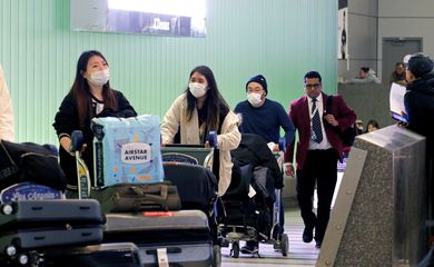 FILE PHOTO: Passengers arrive at LAX from Shanghai, China