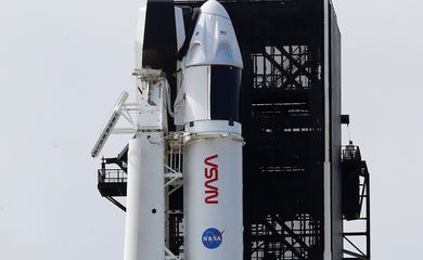 A SpaceX Falcon 9 rocket and Crew Dragon capsule is readied for launch in Cape Canaveral