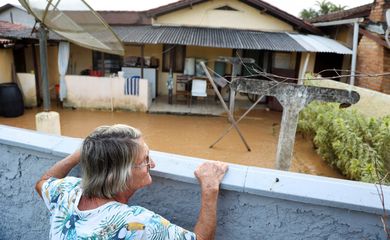Rita Bevenutti, 79, observes the floods after heavy rains in Santa Catarina