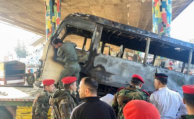 Military police inspect the site of an explosion in central Damascus