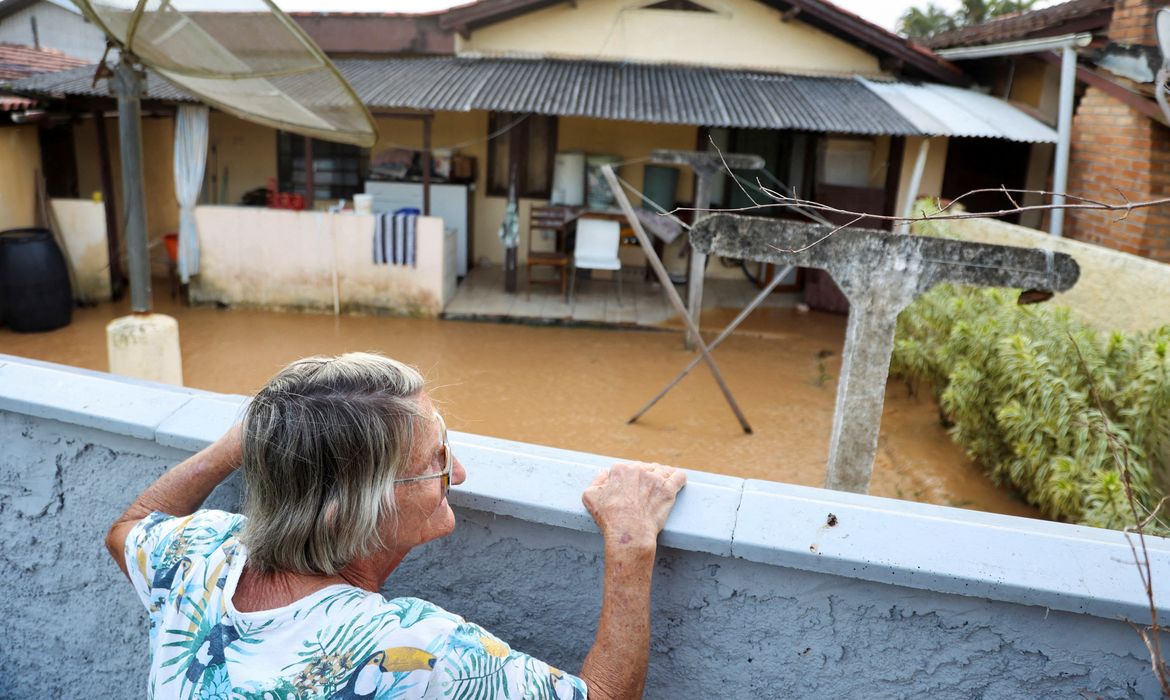 Rita Bevenutti, 79, observes the floods after heavy rains in Santa Catarina