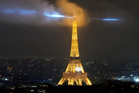 Paris 2024 Olympics - Opening Ceremony - Paris, France - July 26, 2024. A laser show is projected from the Eiffel Tower during the opening ceremony of the 2024 Summer Olympics. Brian Inganga/Pool via REUTERS