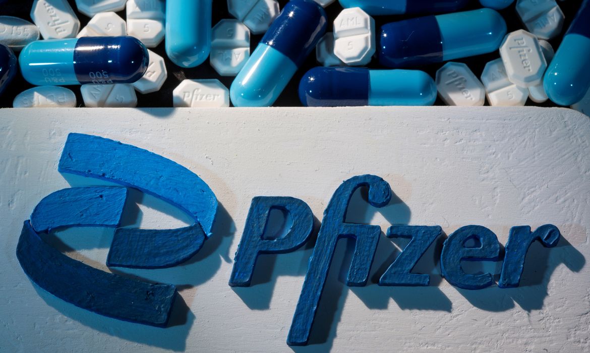 FILE PHOTO: A 3D printed Pfizer logo is placed near medicines from the same manufacturer in this illustration