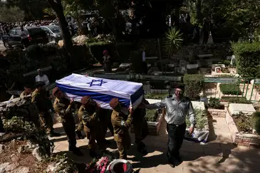 Soldiers carry the coffin of Adi Zur, a soldier who was slain in the assault on Israel by Hamas gunmen from the Gaza Strip, at their funeral at Mount Herzl Military Cemetery in Jerusalem