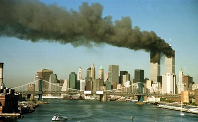 A September 11, 2001 file photo shows the towers of the World Trade Center pour smoke.