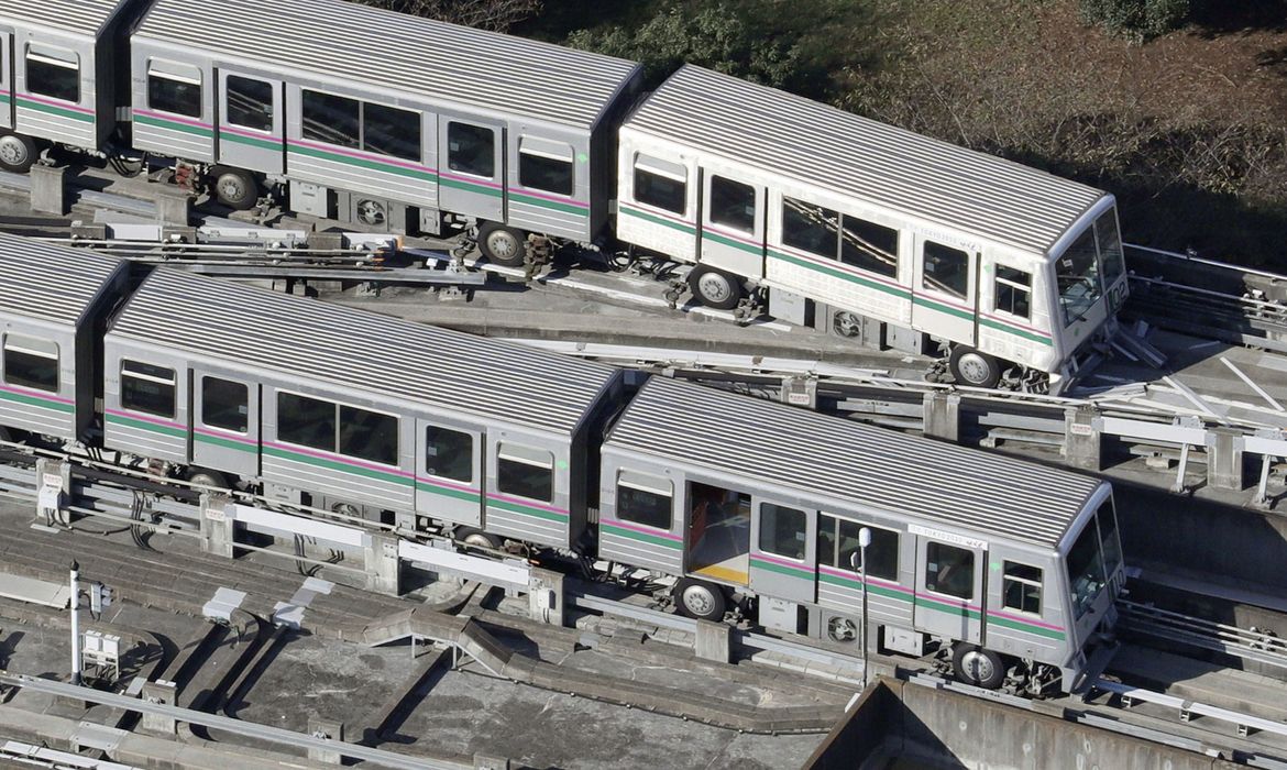 A Nippori-Toneri Liner train is derailed slightly after an earthquake jolted the Tokyo region the previous night in Tokyo