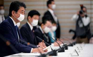 Japan's Prime Minister Shinzo Abe speaks during a meeting about the measures against the coronavirus disease (COVID-19), at the prime minister official residence in Tokyo