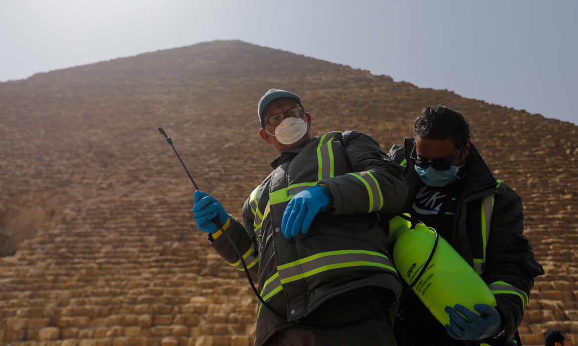 Members of the medical team prepare to spray disinfectant as a precautionary move amid concerns over the coronavirus disease (COVID-19) outbreak at the Great Pyramids, Giza, on the outskirts of Cairo