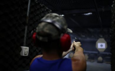 A member of the Colt 45 shooting club fires a gun in Rio de Janeiro, Brazil January 15, 2019. REUTERS/Pilar Olivares