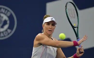 Jul 29, 2025; Montreal, QC, Canada; Beatriz Haddad Maia (BRA) returns the ball against Suzan Lamens (NED) in second round play at IGA Stadium. Mandatory Credit: Eric Bolte-Imagn Images