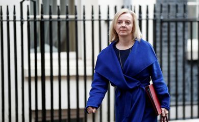 British Foreign Secretary Liz Truss walks outside Downing Street, in London