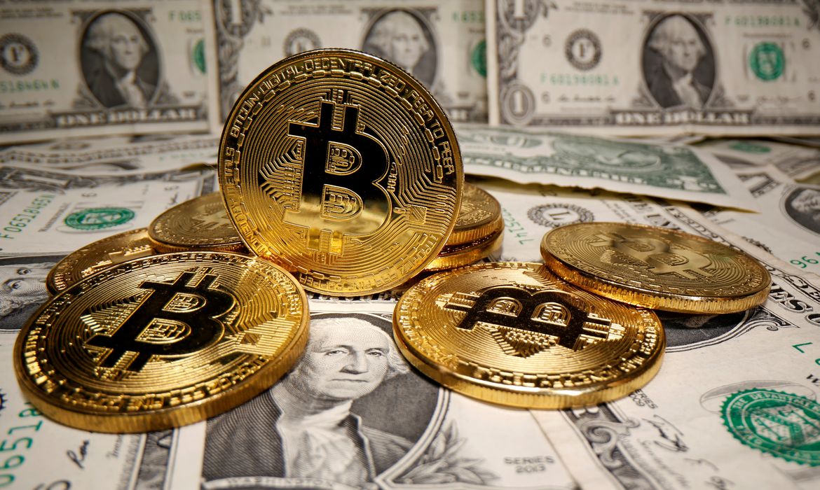 FILE PHOTO: Representations of virtual currency Bitcoin are placed on U.S. Dollar banknotes