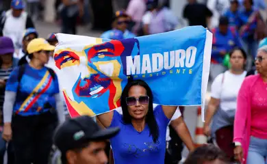 A demonstrator holds a banner as supporters of Venezuela's government rally to demand the release of ousted President Nicolas Maduro and his wife, Cilia Flores, one month after their capture by U.S. during recent U.S. strikes on the country, in Caracas, Venezuela, February 3, 2026. REUTERS/Leonardo Fernandez Viloria